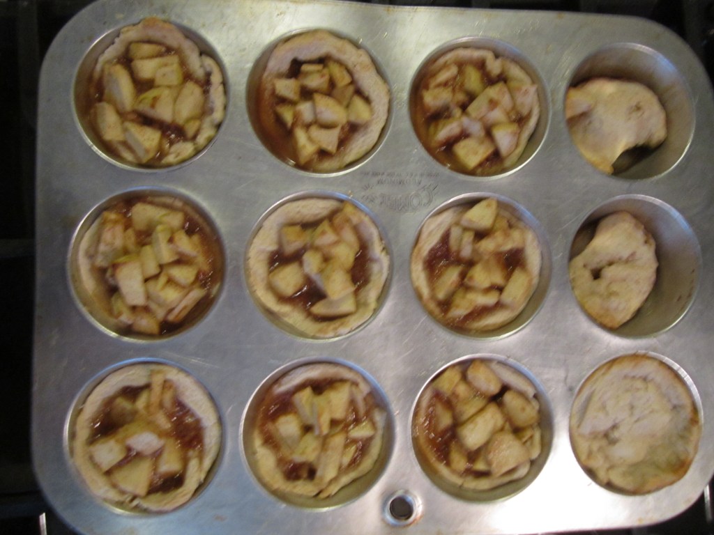 Picture of baked apple pie tarlets.
