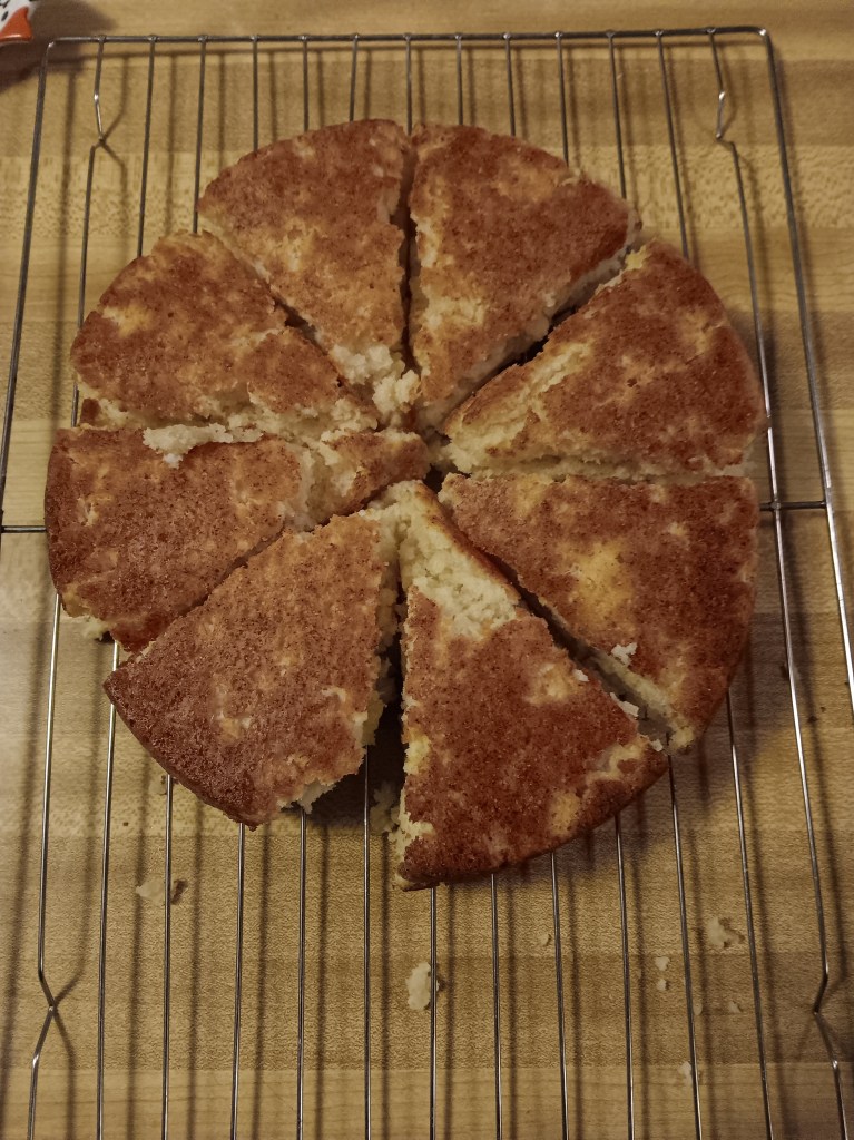 A picture of eight scones, all triangular and upside down.