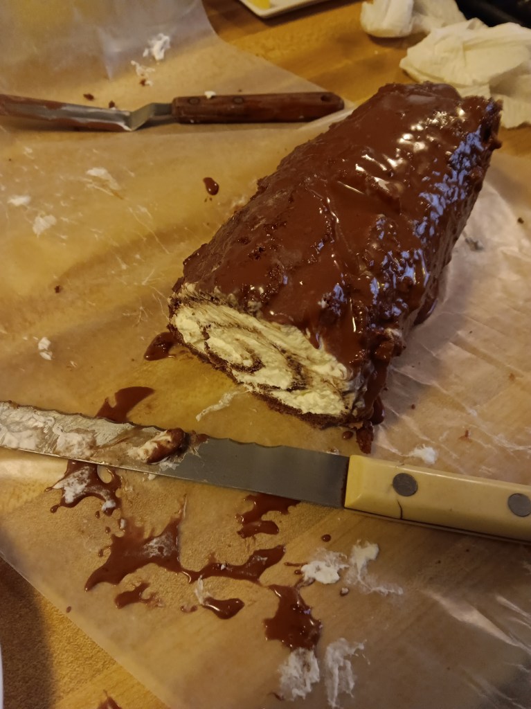chocolate swiss roll with whipped cream filling