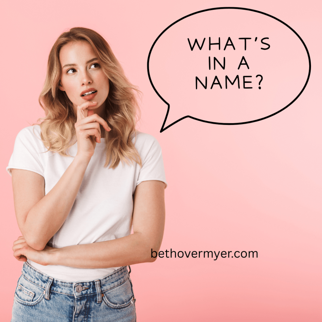 Image of a woman looking thoughtful. A speech bubble comes out of her mouth saying, "What's in a name?"